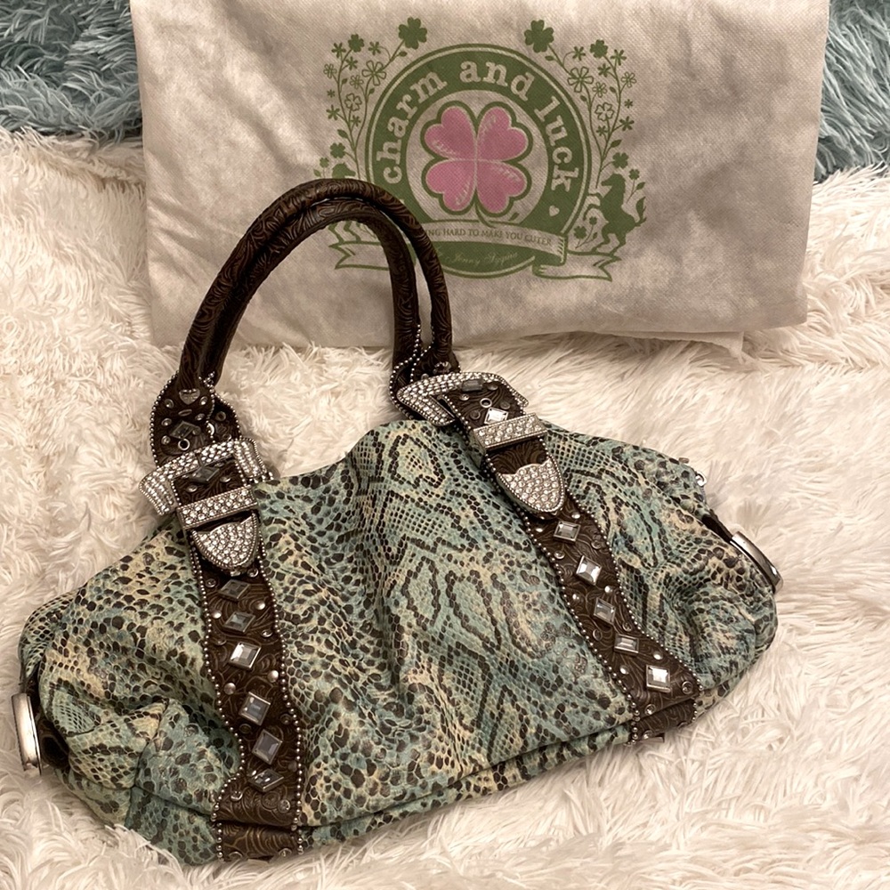 Charm and luck leather teal leopard print handbag. 16inW/9inH